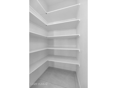 A shining new home in the Catalina Foothills. Located within