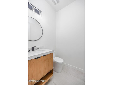 A shining new home in the Catalina Foothills. Located within