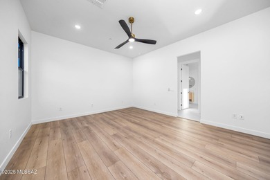 A shining new home in the Catalina Foothills. Located within