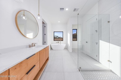 A shining new home in the Catalina Foothills. Located within