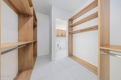 A shining new home in the Catalina Foothills. Located within