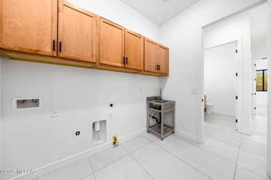 A shining new home in the Catalina Foothills. Located within