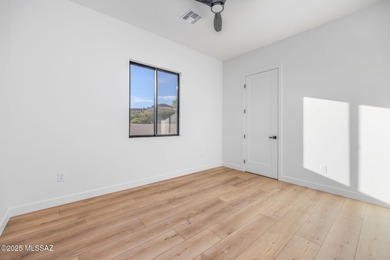 A shining new home in the Catalina Foothills. Located within