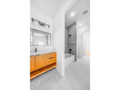 A shining new home in the Catalina Foothills. Located within