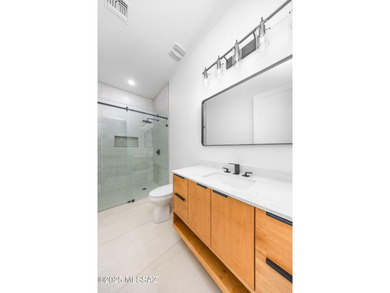 A shining new home in the Catalina Foothills. Located within