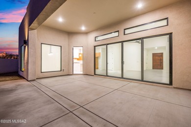 A shining new home in the Catalina Foothills. Located within