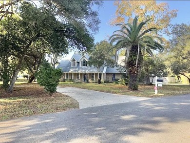 Beautifully updated 4BR/3.5BA coastal home on a prime .34-acre - photo 1