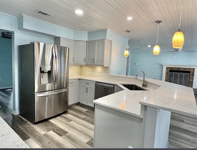 Beautifully updated 4BR/3.5BA coastal home on a prime .34-acre - photo 7