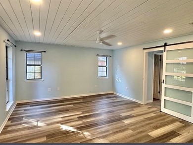 Beautifully updated 4BR/3.5BA coastal home on a prime .34-acre - photo 8