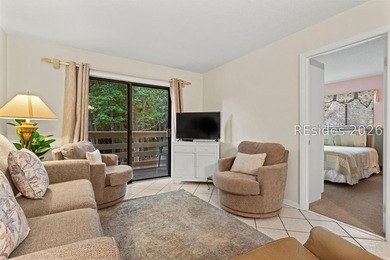 Tucked among mature landscaping in the highly desirable gated - photo 11
