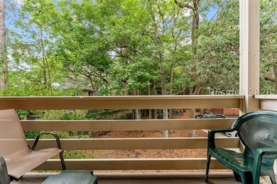 Tucked among mature landscaping in the highly desirable gated - photo 13
