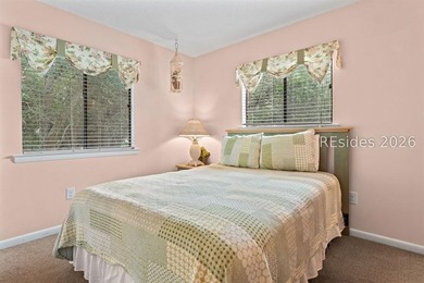 Tucked among mature landscaping in the highly desirable gated - photo 14