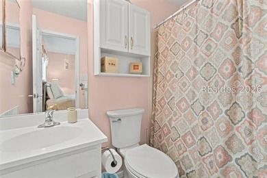 Tucked among mature landscaping in the highly desirable gated - photo 16