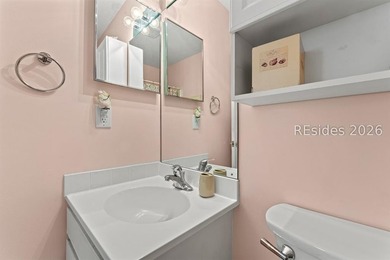 Tucked among mature landscaping in the highly desirable gated - photo 17