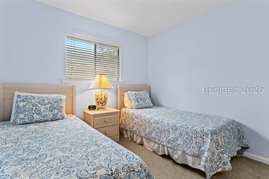 Tucked among mature landscaping in the highly desirable gated - photo 18