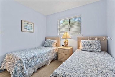 Tucked among mature landscaping in the highly desirable gated - photo 19