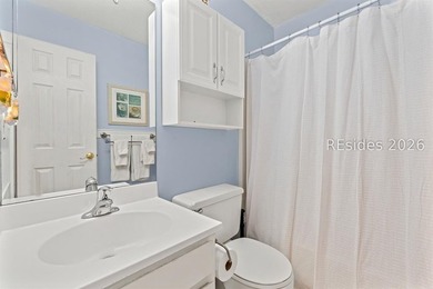 Tucked among mature landscaping in the highly desirable gated - photo 20