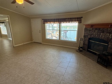 Enjoy a front-row seat to Lake Palestine from this three-bedroom - photo 4