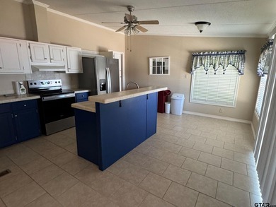 Enjoy a front-row seat to Lake Palestine from this three-bedroom - photo 10