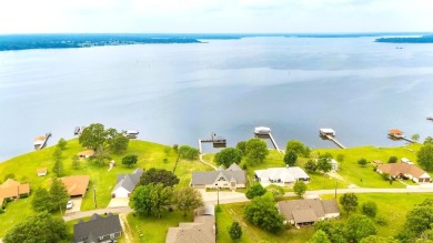 Discover a waterfront sanctuary with a 180-degree view of Lake - Lake Home For Sale in Emory, Texas