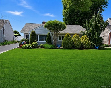 Welcome to this beautifully updated sprawling ranch in the - photo 3