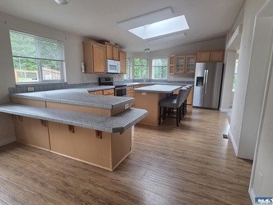 Space and natural light abound in this beautifully maintained - photo 12