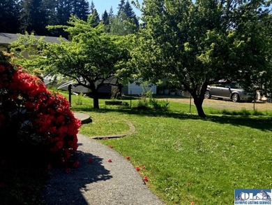 Space and natural light abound in this beautifully maintained - photo 32