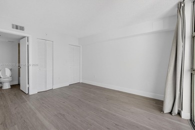 This beautifully and completely updated top floor, split bedroom