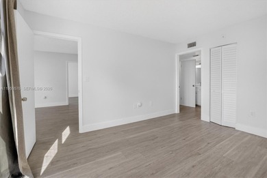 This beautifully and completely updated top floor, split bedroom