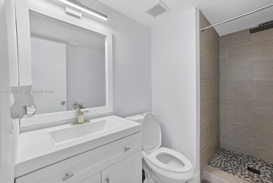 This beautifully and completely updated top floor, split bedroom