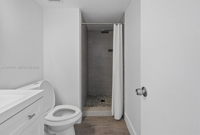 This beautifully and completely updated top floor, split bedroom