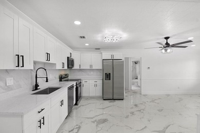 Fully renovated 3-bedroom, 2-bath home featuring a desirable - photo 11