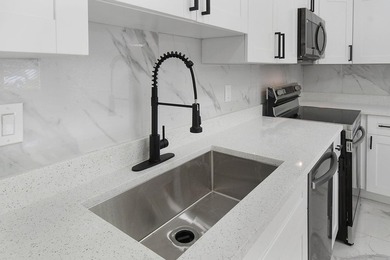 Fully renovated 3-bedroom, 2-bath home featuring a desirable - photo 12