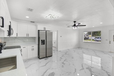 Fully renovated 3-bedroom, 2-bath home featuring a desirable - photo 13