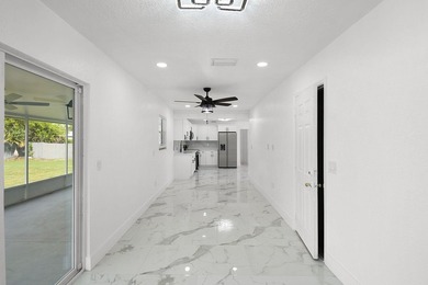 Fully renovated 3-bedroom, 2-bath home featuring a desirable - photo 16