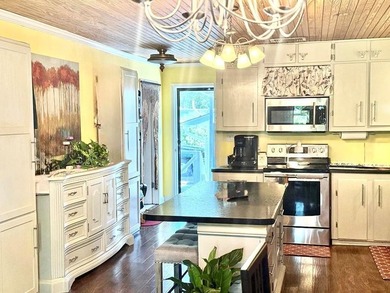 WATERFRONT! Tucked within a peaceful cove, this home is made for - photo 3