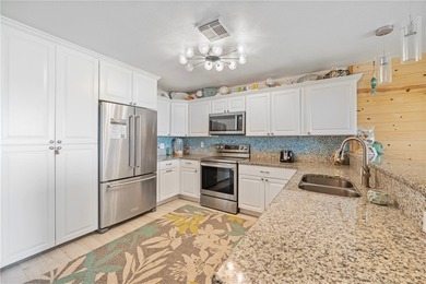 BEACHFRONT BEAUTY! Fabulously updated, this spacious 3-bedroom - photo 13