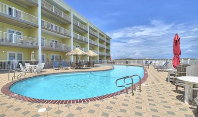 BEACHFRONT BEAUTY! Fabulously updated, this spacious 3-bedroom - photo 31