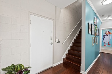 Beautifully updated duplex corner residence offering an - photo 3