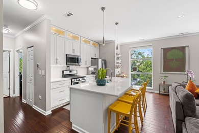 Beautifully updated duplex corner residence offering an - photo 4