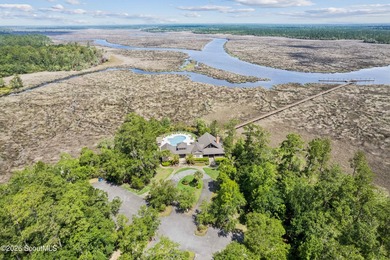 Welcome to this stunning custom-built marsh front home in the - photo 11