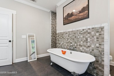 Welcome to this stunning custom-built marsh front home in the - photo 17