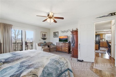 Tucked away on nearly an acre of serene, wooded land with - photo 19