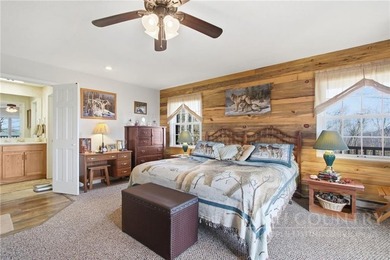 Tucked away on nearly an acre of serene, wooded land with - photo 20