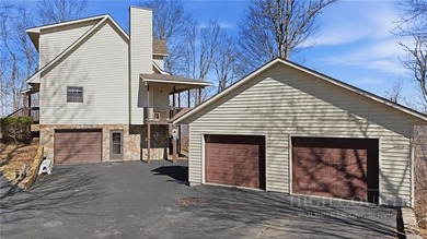 Tucked away on nearly an acre of serene, wooded land with - photo 39