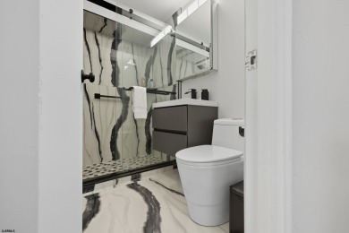 Exceptional shorefront living! This beautifully renovated condo