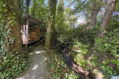 Tucked into a peaceful, creekside setting, this 3-bedroom - photo 44