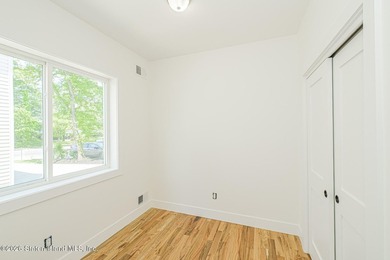 An exceptional new construction 6/6 two-family home offering 2 - photo 12