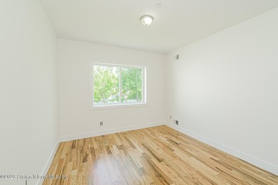 An exceptional new construction 6/6 two-family home offering 2 - photo 15