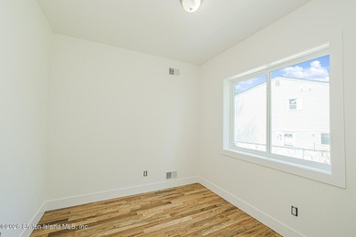 An exceptional new construction 6/6 two-family home offering 2 - photo 18